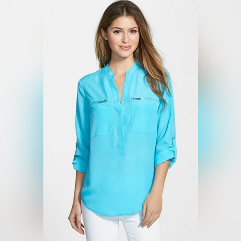 Women’s Calvin Klein dress shirt, size S. No flaws.